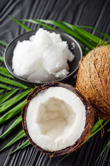 fresh natural coconut butter on black wooden background