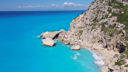 Aerial drone top down photo of tropical exotic paradise secluded rocky bay with deep turquoise sea forming a blue lagoon