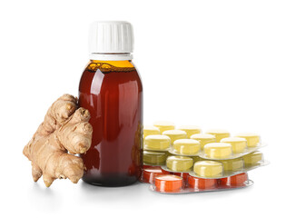 Pills for sore throat, cough syrup and ginger on white background