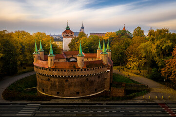 Barbican and St. Florian's Gate in Krakow in autumn scenery - obrazy, fototapety, plakaty