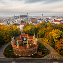 Barbican and Old Town in Krakow in autumn scenery - obrazy, fototapety, plakaty