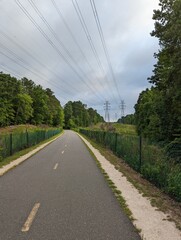 Greenway for running and biking with powerlines overhead on an overcast day in North Carolina
