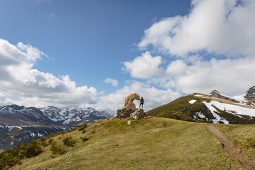 Mountains, sky, clouds and a bear