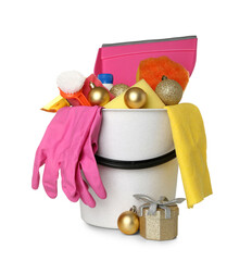 Bucket with cleaning supplies, Christmas balls and gift on white background
