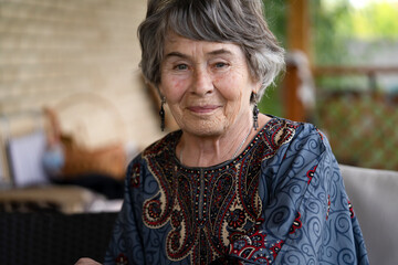 Happy old woman with smiling face closeup view.
