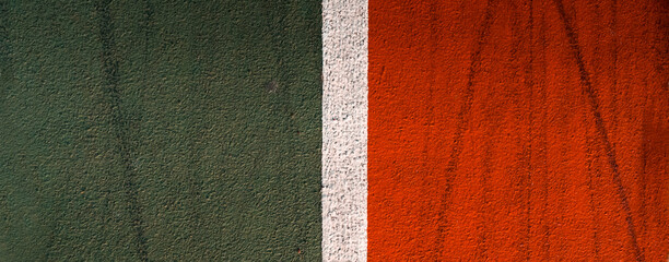 Running track with red, green and white lines closeup.
