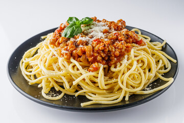 delicious Bolognese pasta on a black plate