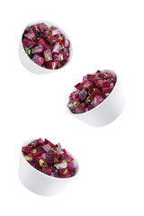 Mexican beet salad in a bowl on a white isolated background