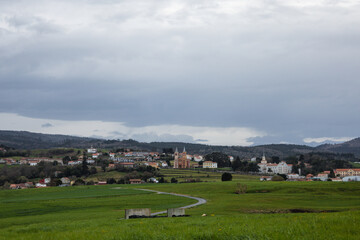 Cloudy landscape, village in Cantabria valley