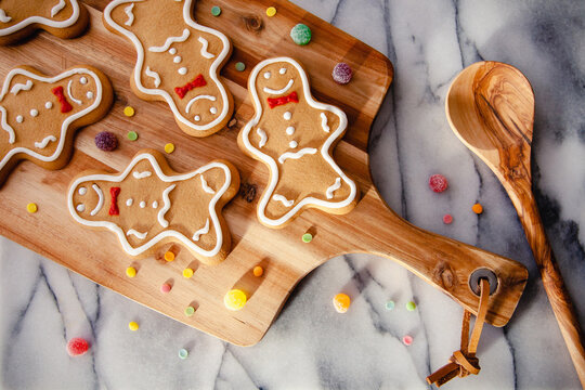 A Rustic, Festive Baking Scene With Gingerbread Men And Gumdrops, On A Marble Worktop Background. Perfect For The Christmas Holiday Season. 