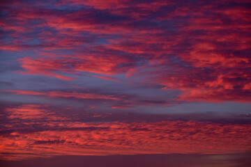 Bloody red sunset sky with beautiful clouds
