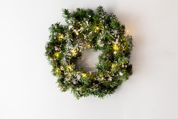 simple christmas wreath with garland on white background.