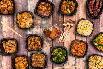 Food bowls for home delivery with recipes for Asian food and vegetables, stews, stir fry noodles, spring rolls and copper cutlery