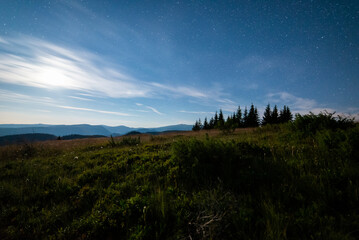 Night view of High Tatras from Panska Hola, Low Tatras National Park Slovakia.Green meadows and mountains in the background.