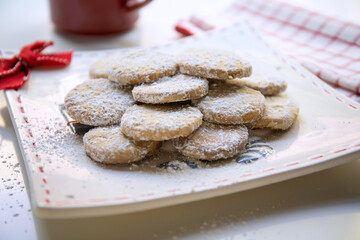 Christmas sugar cookies on a plate, light background with space for text
