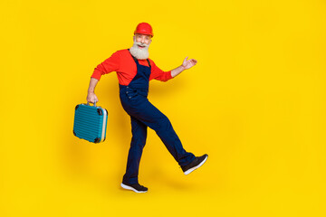 Full length profile side photo of funky pensioner workman hold toolkit box step reconstruct isolated shine color background
