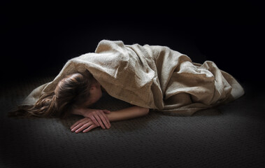 Young woman lies on the floor