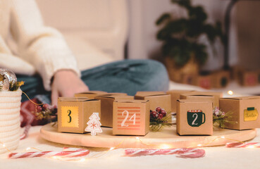 Advent calendar boxes with numbers on the bed.