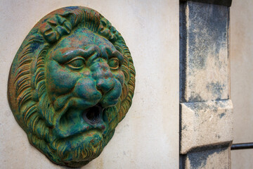 Montbonnot France 13 11 2022 aged bronze lion head gargoyle fountain