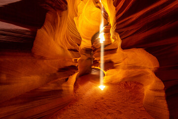 Famous midday sun ray in a slot canyon Antelope. The Navajo reservation, Arizona, USA
