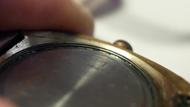 Disassembly of the case of a mechanical watch for repair with the removal of the back cover