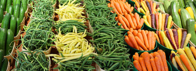 Group of fresh and healthy carrots from a fruit market and fresh organic Green and Yellow beans on...