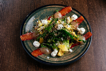salad with salmon vegetables and herbs