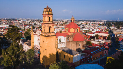 Fototapeta na wymiar Aerial photo of Main church of Metepec, Mexico, painted yellow in the baroque style