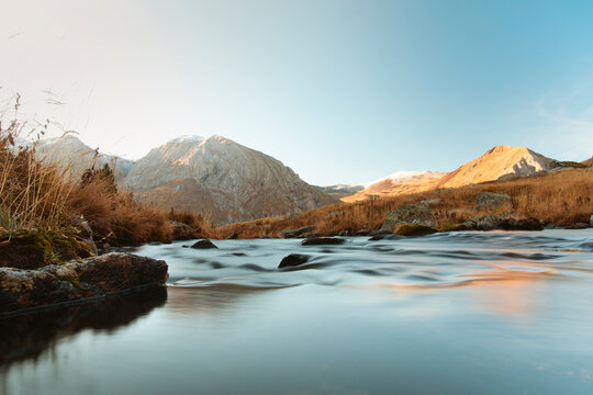River crossing a valley with a mountain in the background