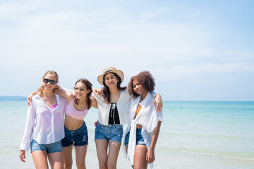 Happy teenagers at beach party together on the beach having fun in a sunny day, Beach summer holiday sea people concept