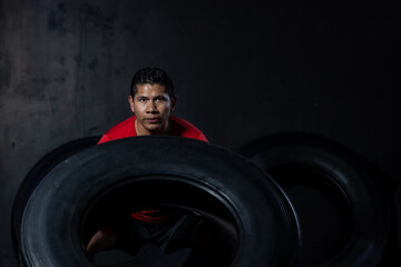Fototapeta na wymiar young mexican latino man doing crossfit training and weightlifting