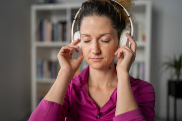 one woman doing guided meditation yoga self care practice at home