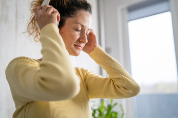 one woman doing guided meditation yoga self care practice at home