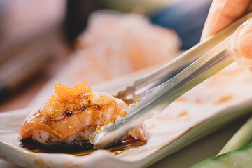 Salmon sushi is a popular fish dish. sushi is a street food of japan and new business in the world.