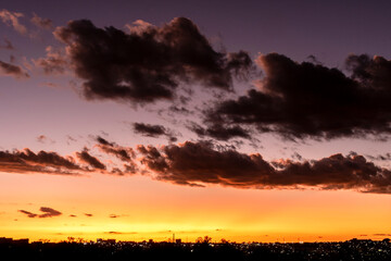 Sunset in the sky with clouds,  Awesome epic landscape. Amazing vibrant colors im Brazil