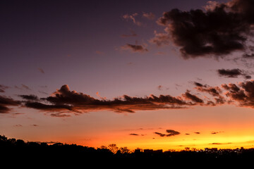 Sunset in the sky with clouds,  Awesome epic landscape. Amazing vibrant colors im Brazil