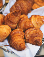 Set of coffee break in the hotel during conference meeting, with tea and coffee catering, decorated banquet table with variety of different desserts, pastry and bakery, with croissants and cookies