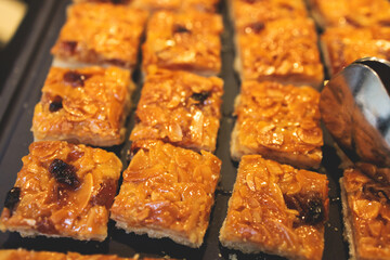 Set of coffee break in the hotel during conference meeting, with tea and coffee catering, decorated banquet table with variety of different desserts, pastry and bakery, with croissants and cookies
