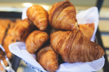Set of coffee break in the hotel during conference meeting, with tea and coffee catering, decorated banquet table with variety of different desserts, pastry and bakery, with croissants and cookies