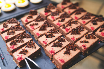 Set of coffee break in the hotel during conference meeting, with tea and coffee catering, decorated banquet table with variety of different desserts, pastry and bakery, with croissants and cookies