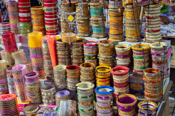 Fototapeta premium Beautiful Rajasthani Bangles being sold at famous Sardar Market and Ghanta ghar Clock tower in Jodhpur, Rajasthan, India.