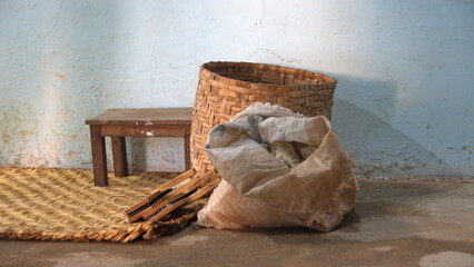 Tools on a woven mat at an indigenous weaver's workshop in Carabuela, Ecuador