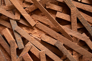 A pile of wood pieces with saw dust