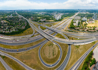Round circle exit or entrance to highway for high speed commute and road traffic avoidance. Cars...