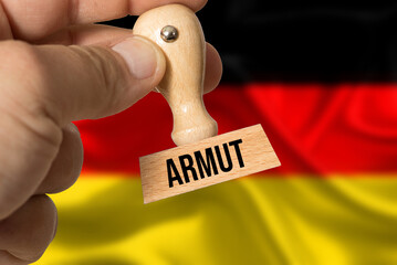 Flagge von Deutschland und Stempel Armut