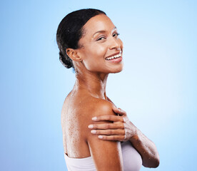 Black woman, shower and wet body on blue background for skincare, beauty and wellness, personal...