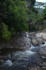 Panorama view of waterfall with big rock in Asia