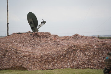 Almaty, Kazakhstan - 04.14.2022 : Radar equipment is installed in a camouflage cape. Military...