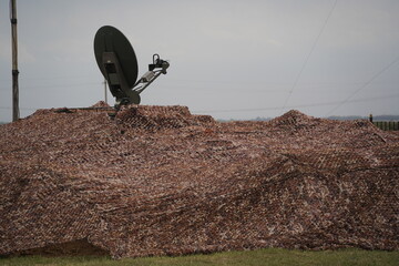 Almaty, Kazakhstan - 04.14.2022 : Radar equipment is installed in a camouflage cape. Military...