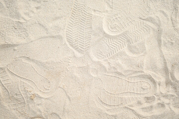 Fototapeta na wymiar Sea beach sand with foot print texture background